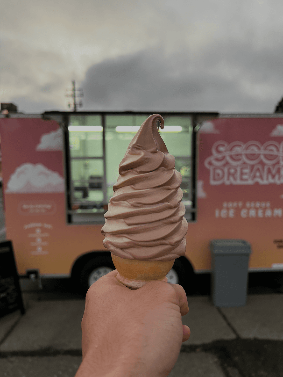 Chocolate swirl cone in front of the Scoop Dreams trailer